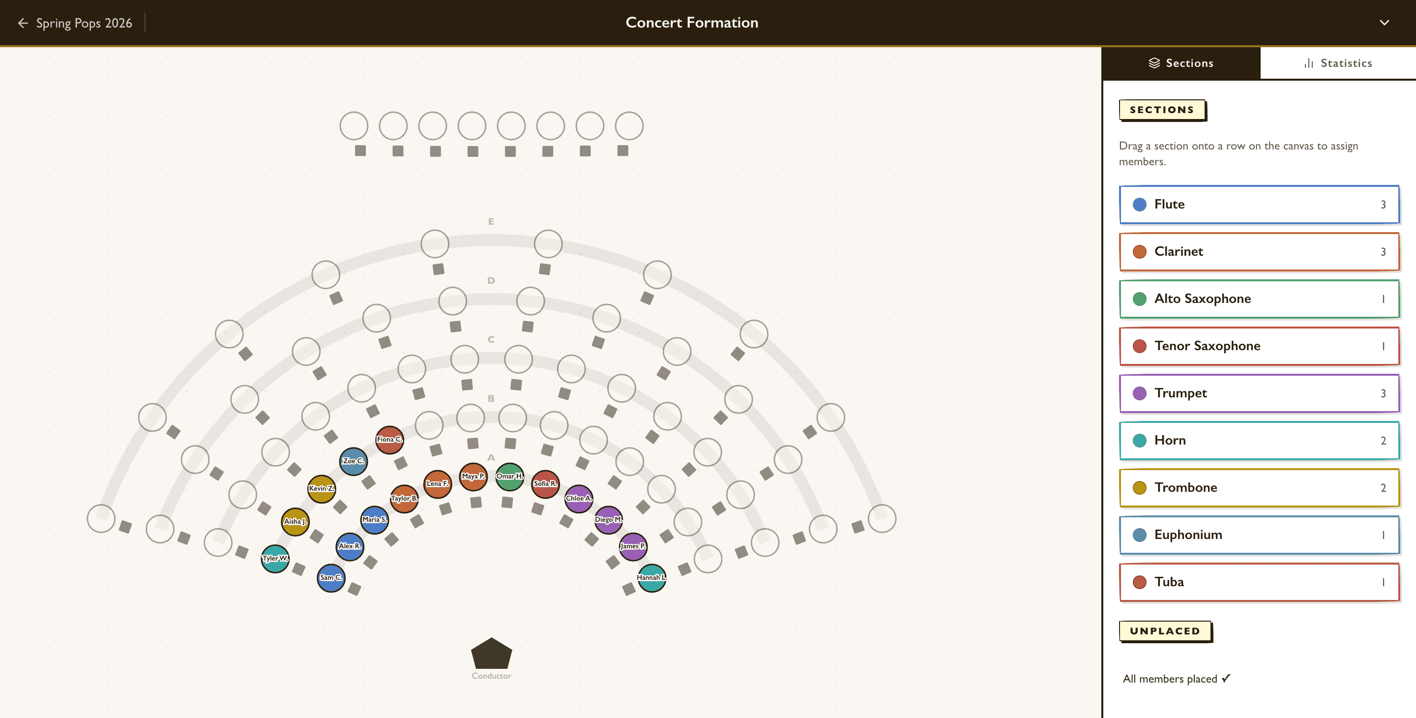 Concert band seating chart in arced rows, with flute, clarinet, saxophone, trumpet, horn, trombone, euphonium, and tuba sections in their own colors